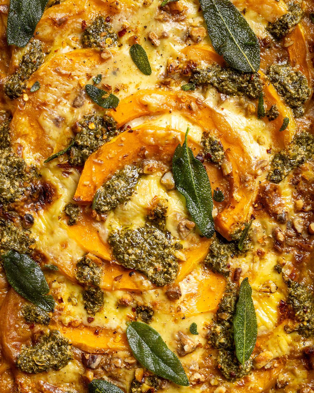Melted vegan cheese on a squash traybake.
