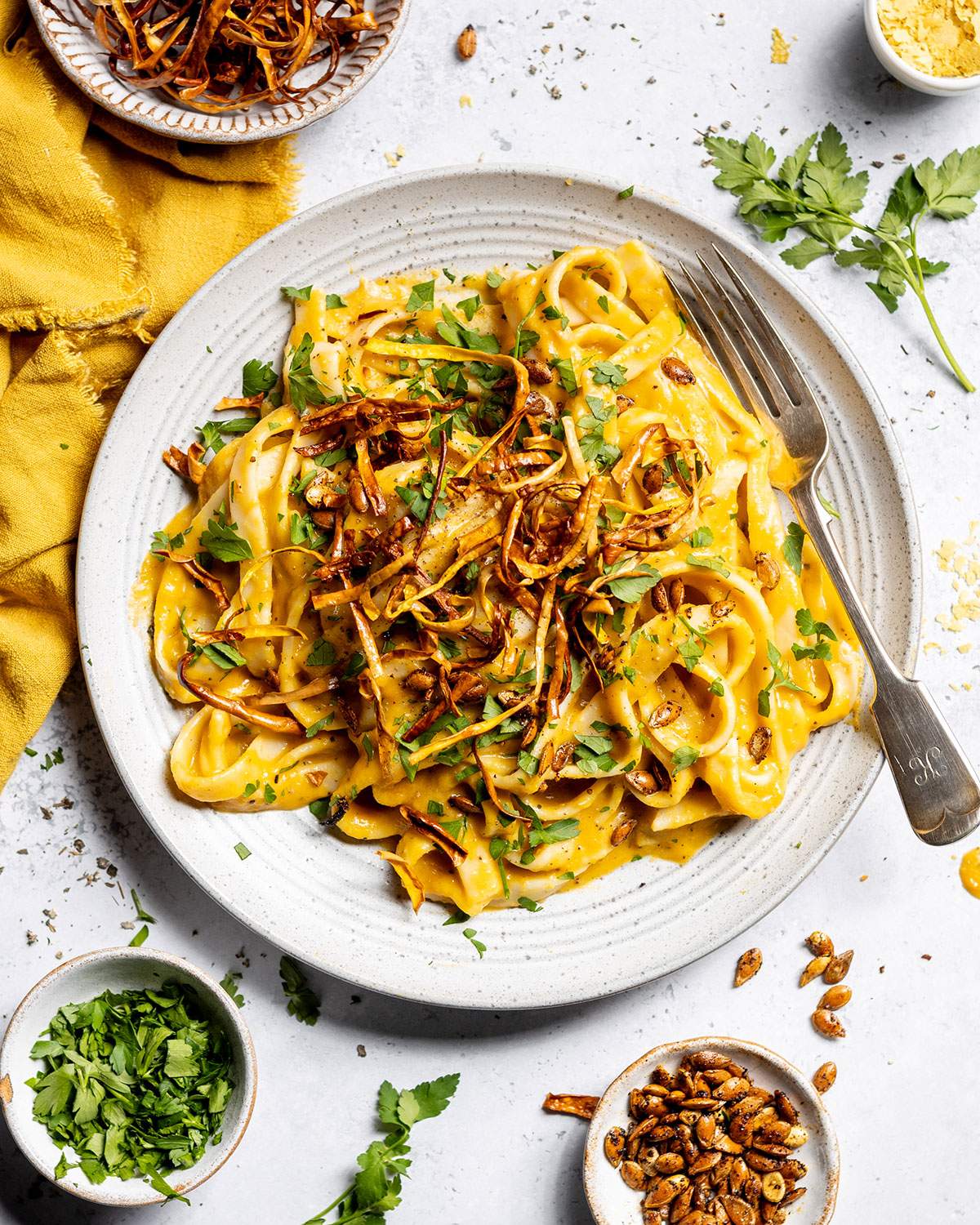 A plate of creamy butternut squash pasta on the dining table.