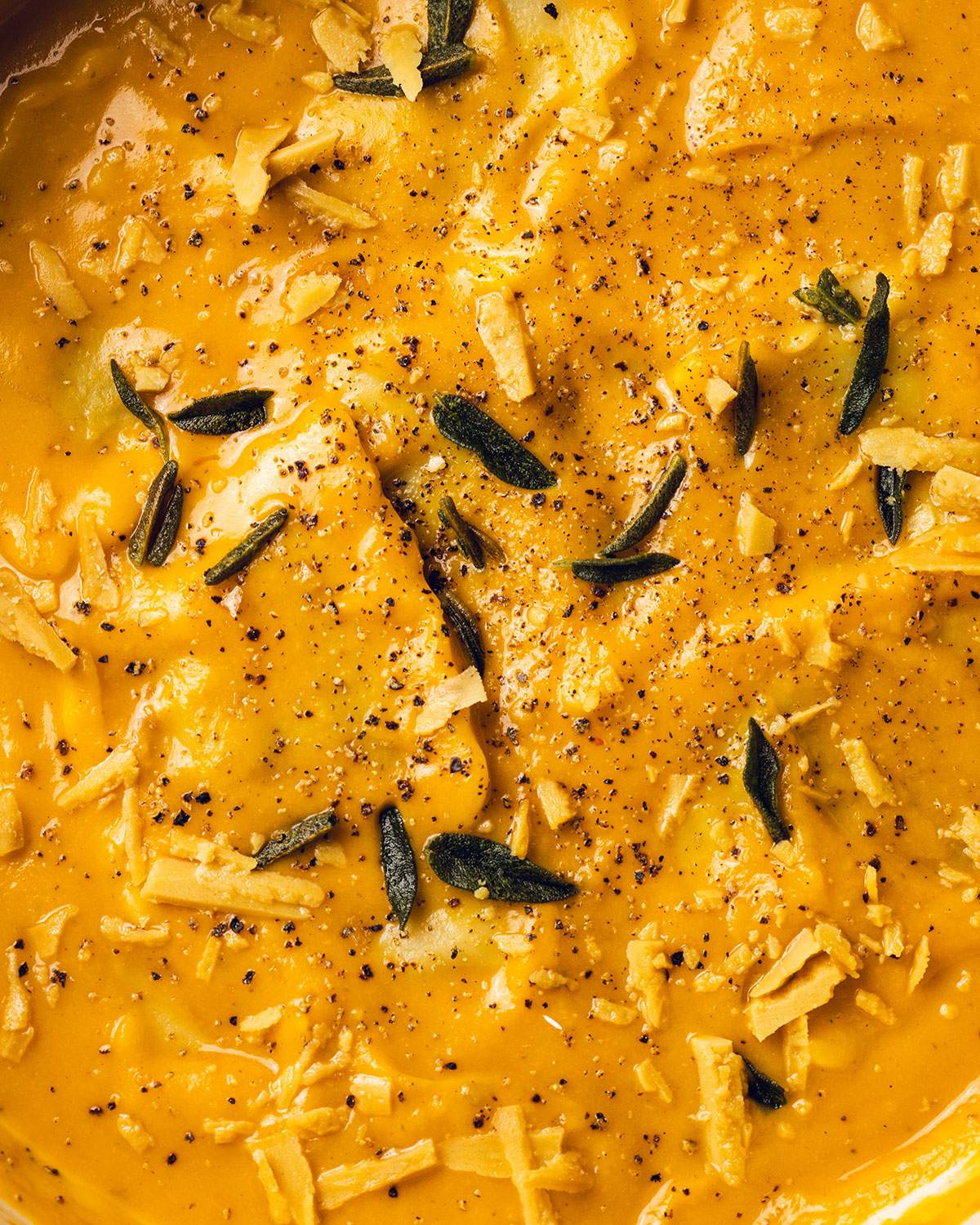 Ravioli in a creamy pumpkin sauce up close.