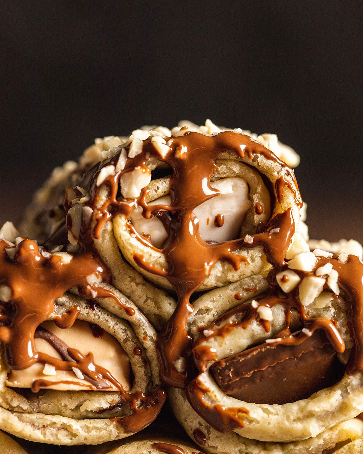 A vegan stuffed crepe with chocolate drizzle up close.