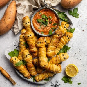 Pastry Wrapped Sweet Potato Mummies on a serving platter.