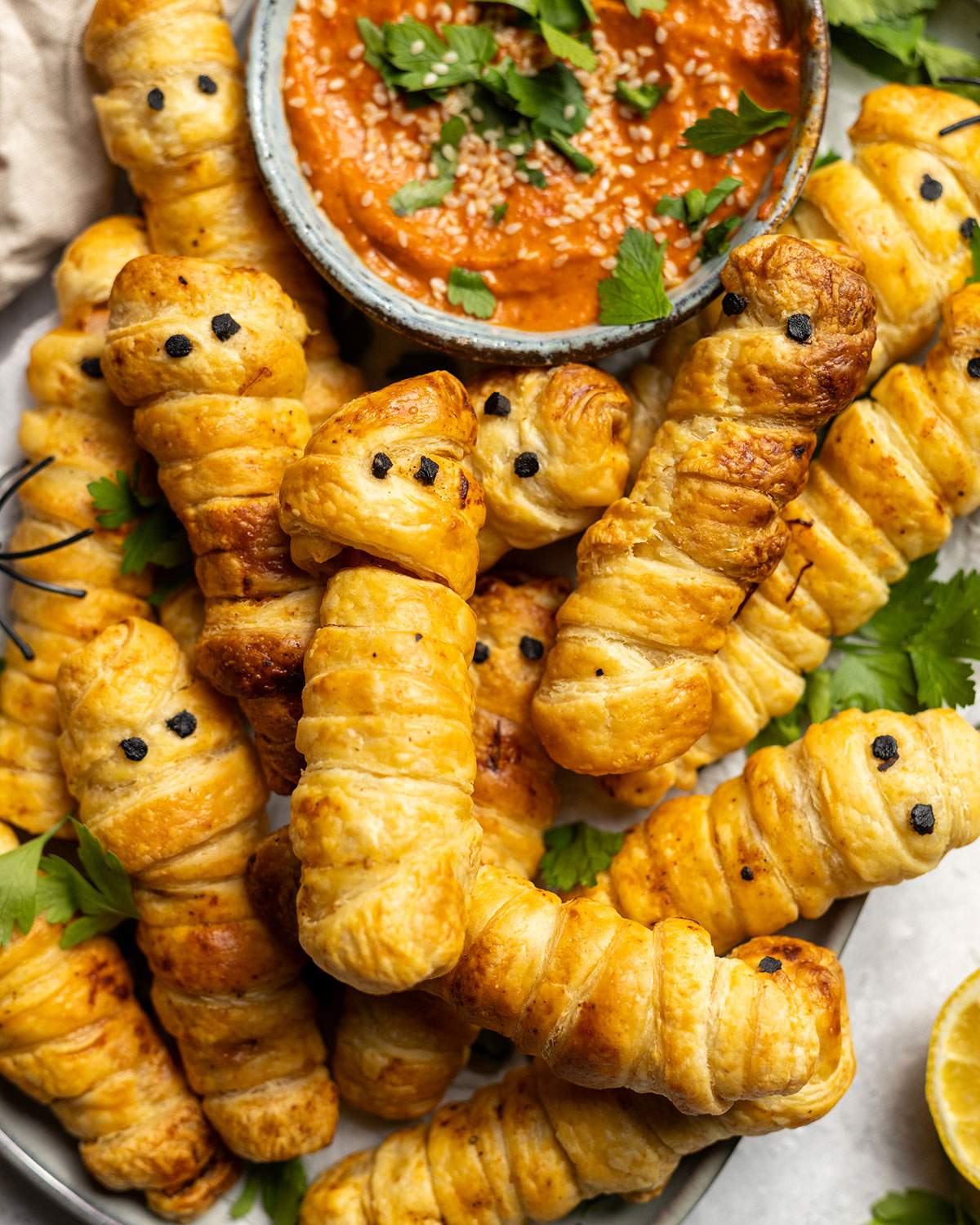 Pastry Wrapped Sweet Potato Mummies on a serving platter.
