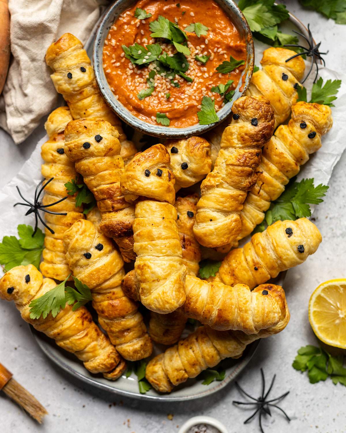 A platter with sweet potato fingers and a dip on the side.