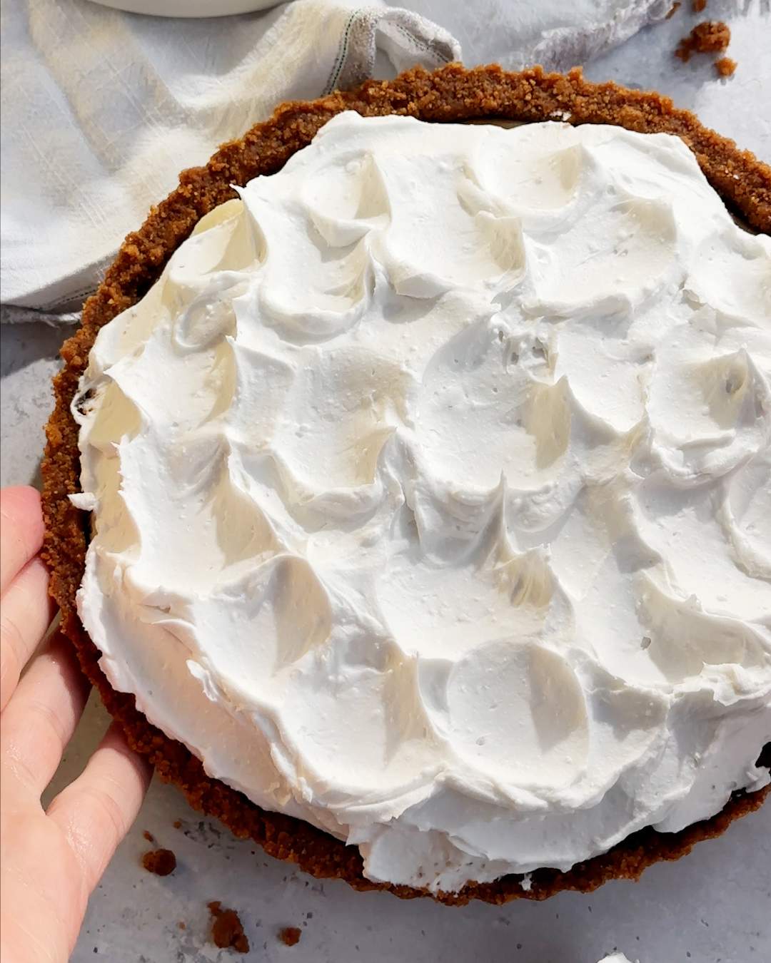 A Layer of whipped cream on a pie.