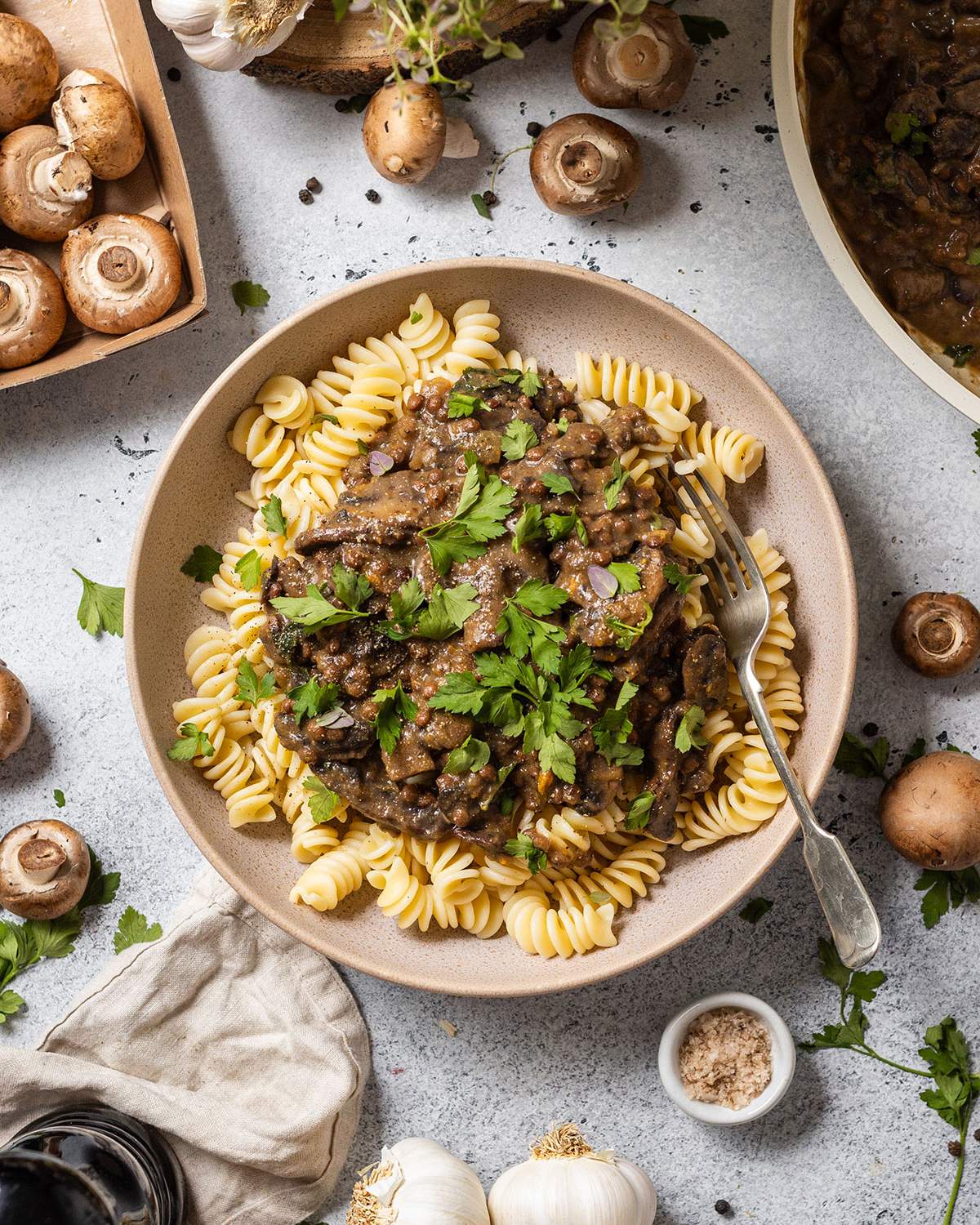Lentil and mushroom Stroganoff on a bowl of pasta.