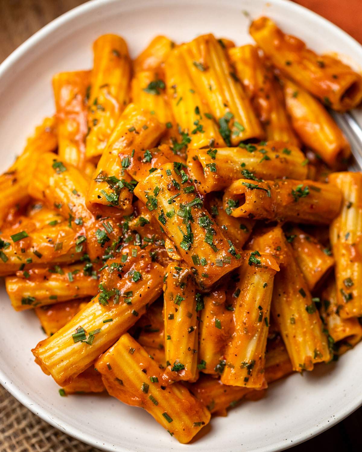 Creamy rigatoni in tomato sauce up close.