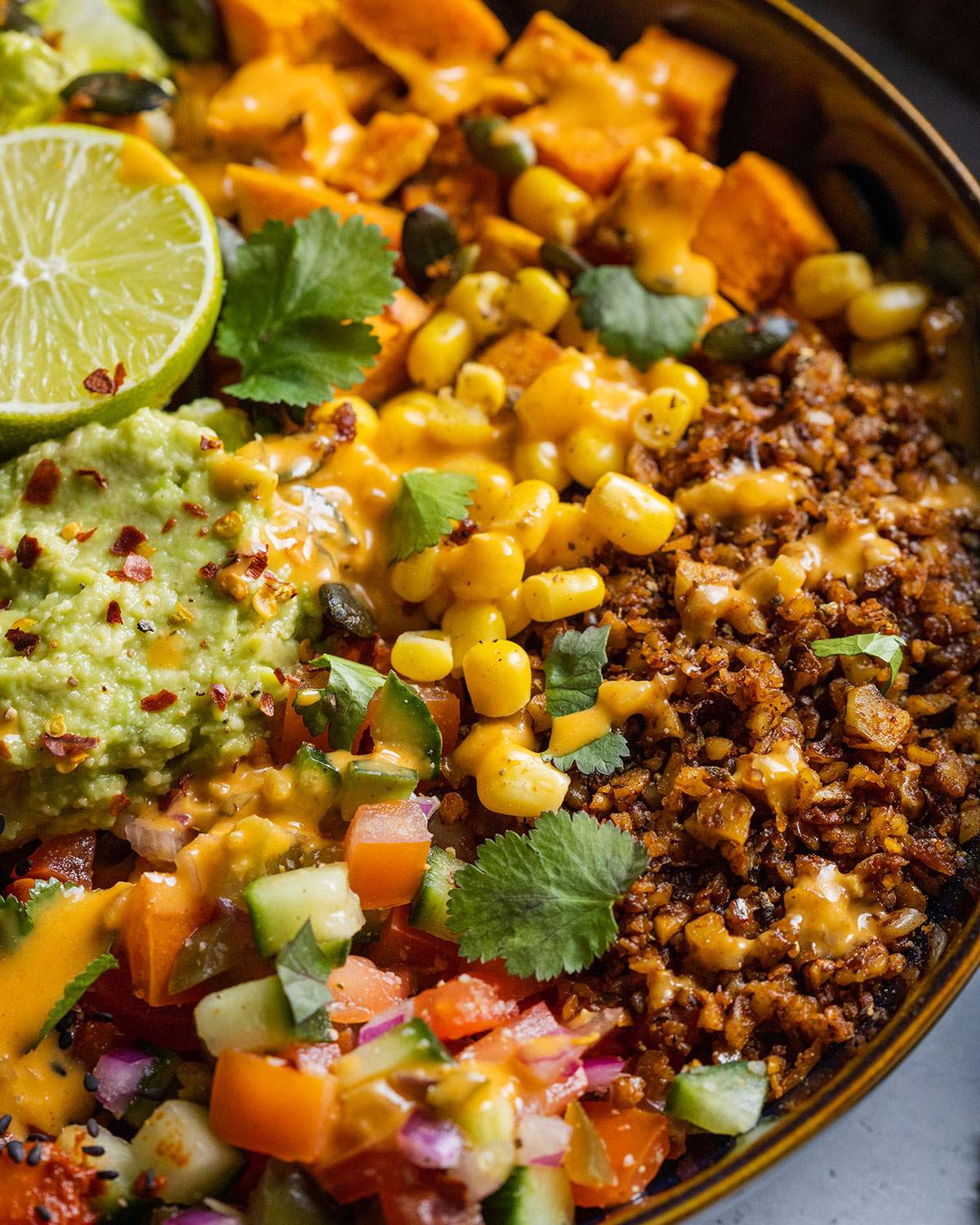 Sweetcorn, mince and vegetables on a vegan burrito bowl.