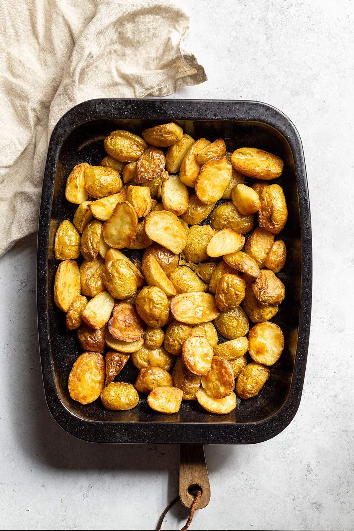 Vegan Roast potatoes in an oven dish.