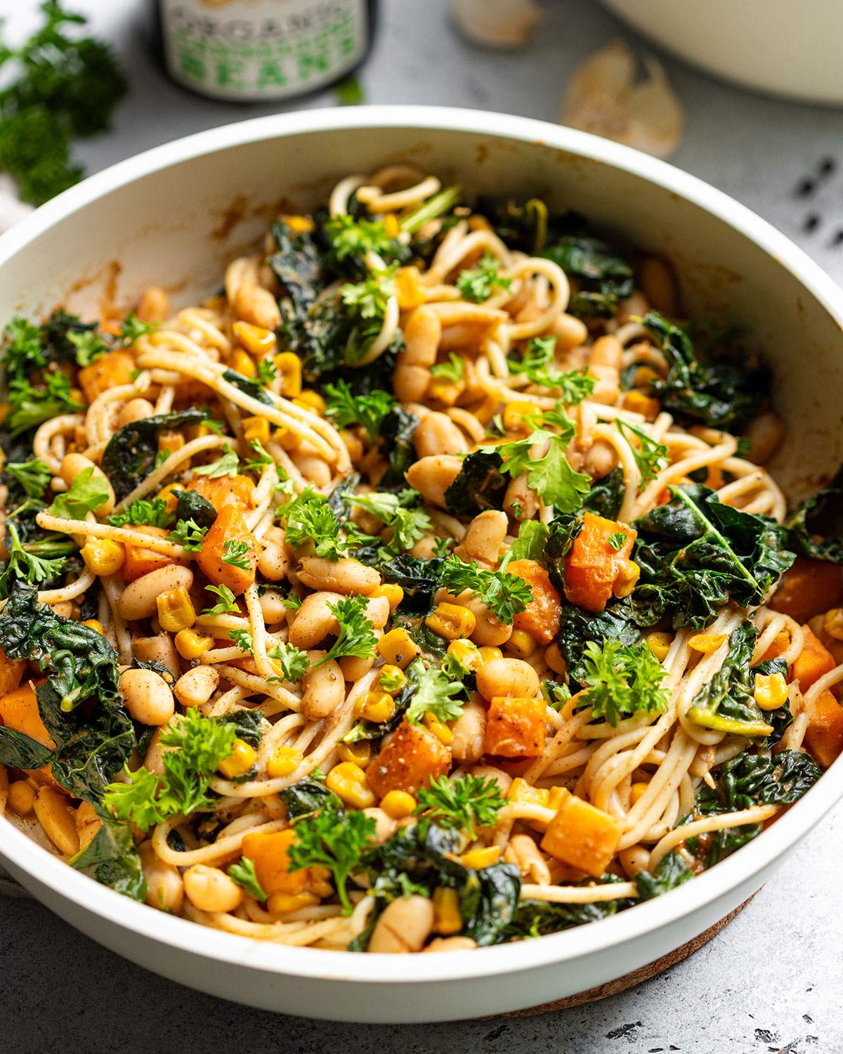 Satay pasta shown up close in a skillet. 