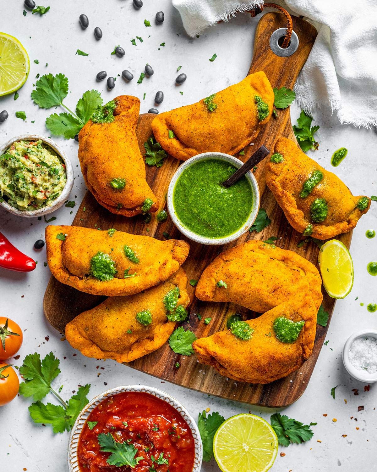 Air fryer empanadas on a serving board.