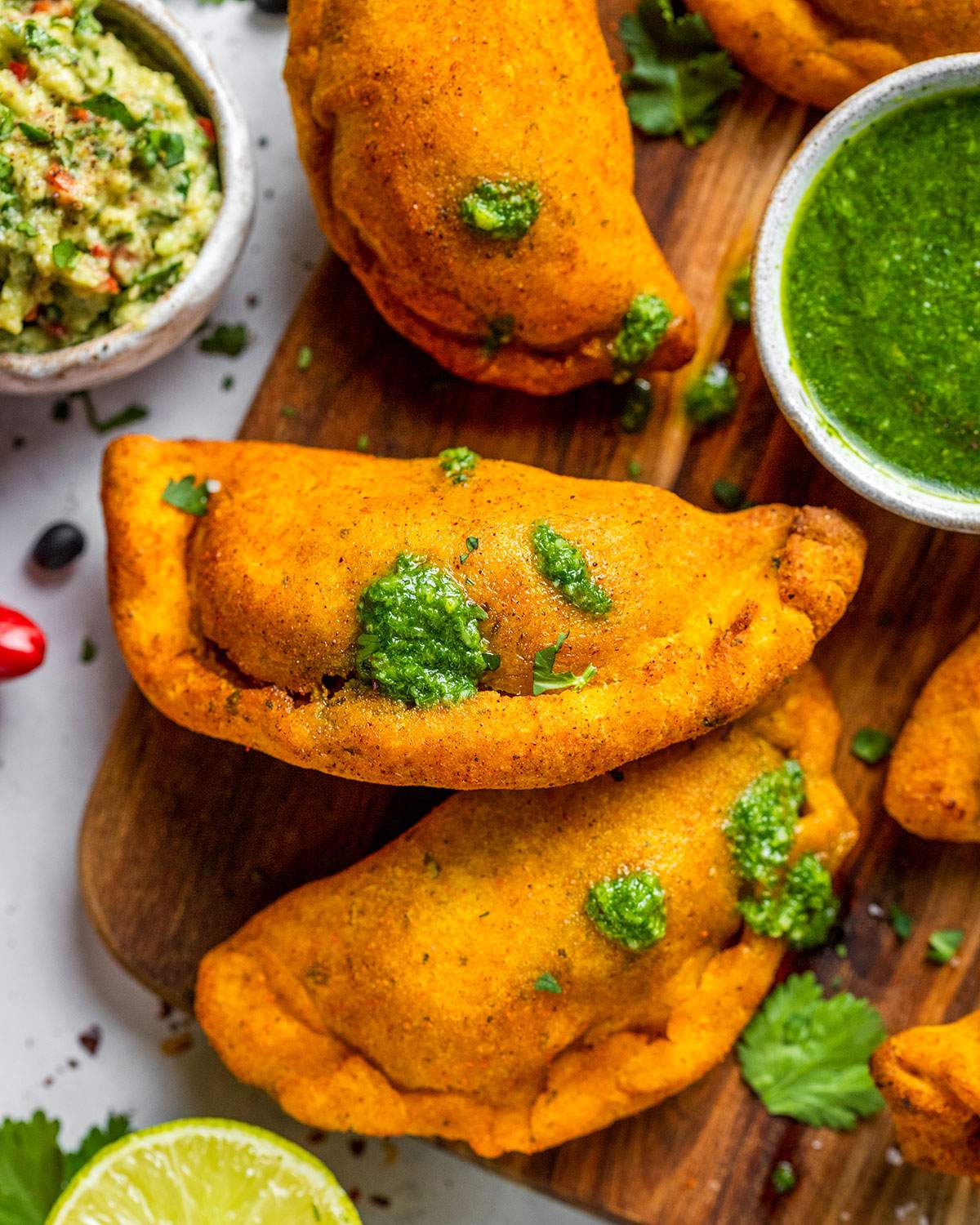 Air fryer empanadas on a serving board.
