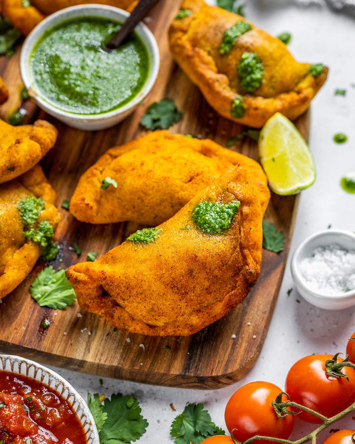 Air fryer empanadas on a serving board.