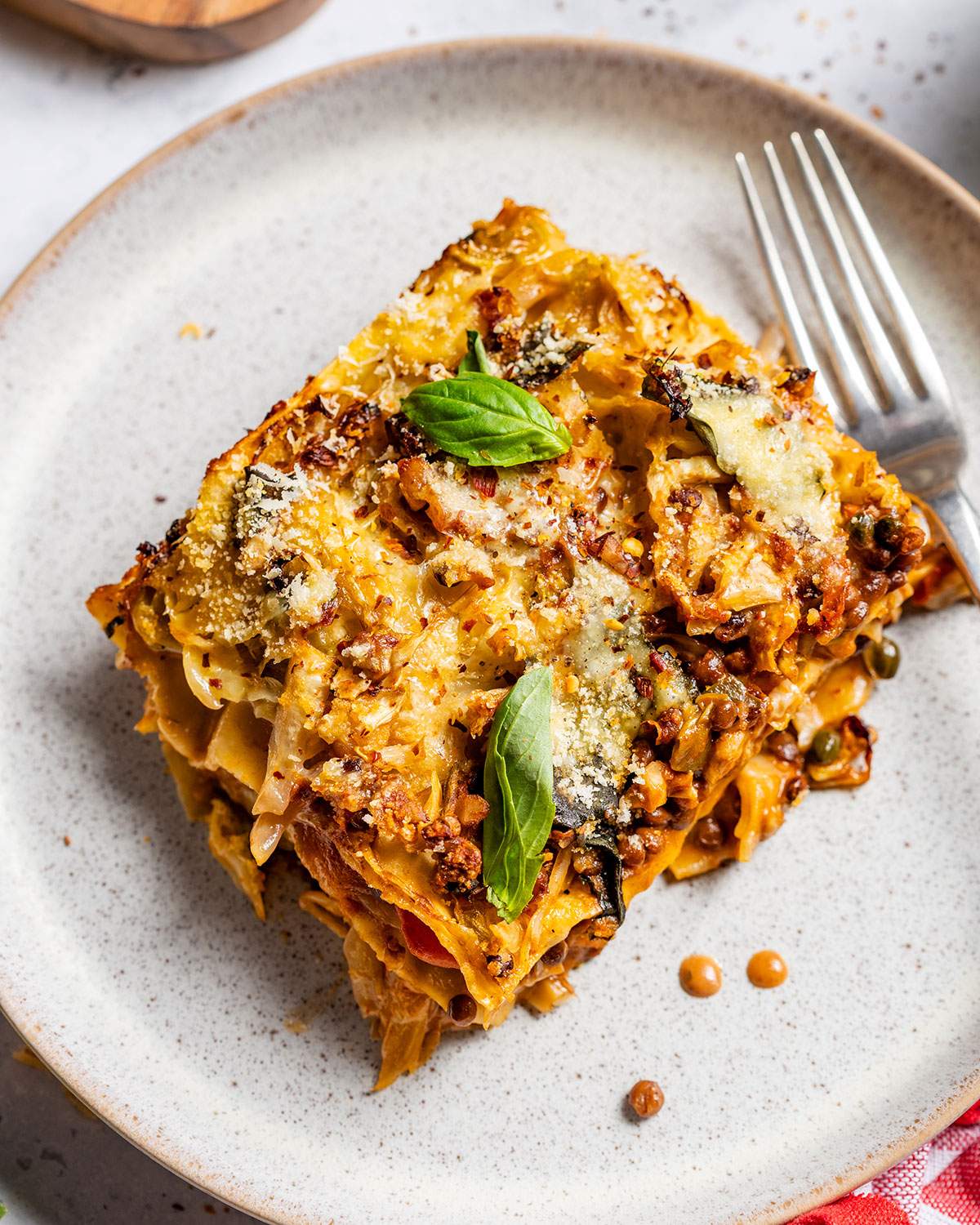 A slice of vegan cabbage lasagna on a plate.