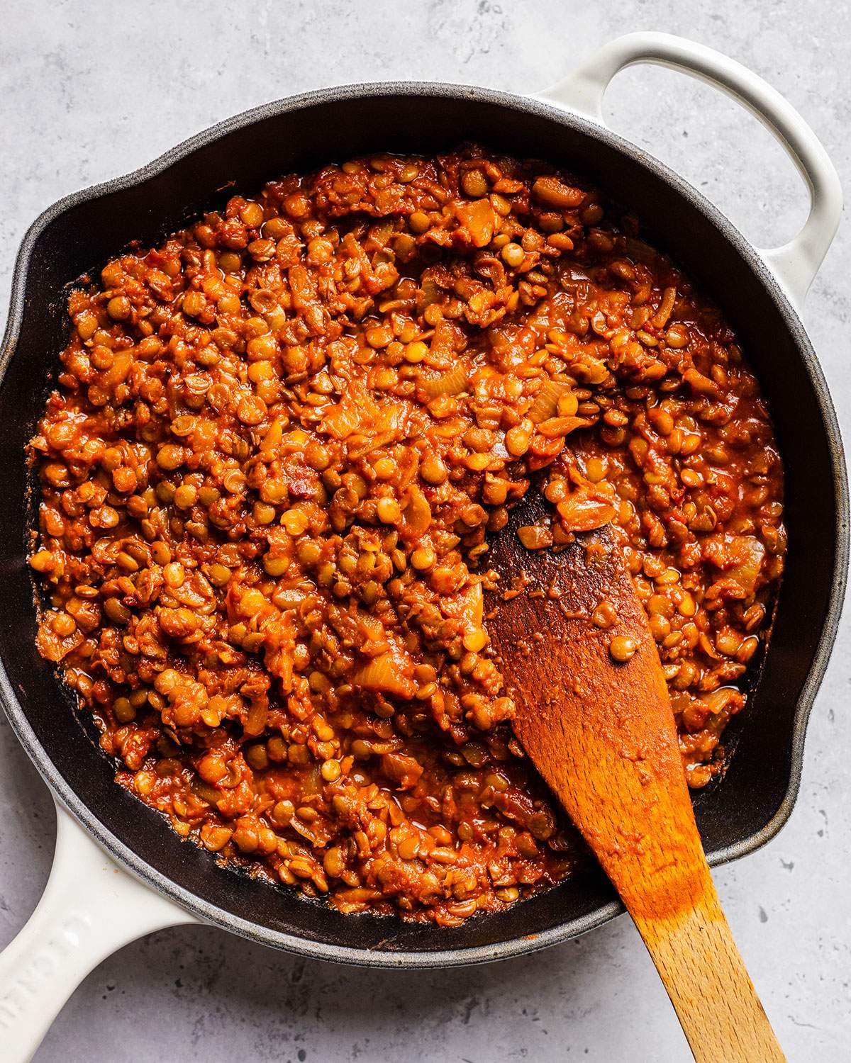 Lentil sloppy joe mix in a skillet.