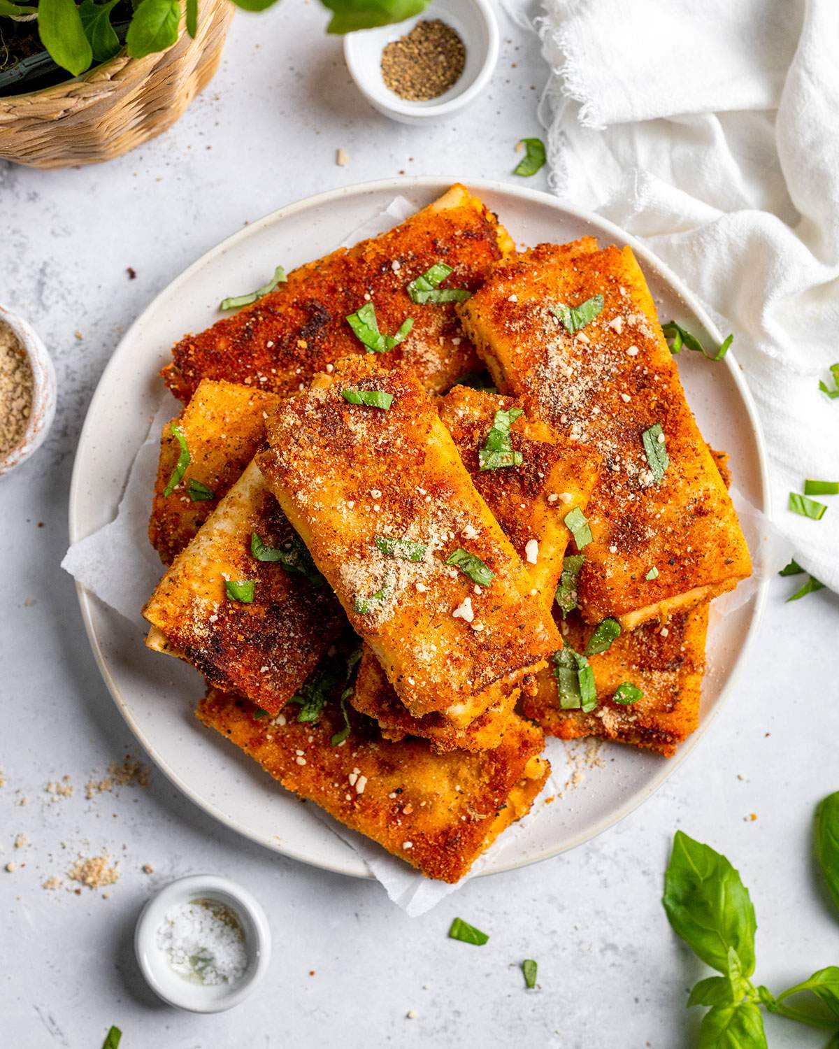 Crispy lasagna rolls on a serving plate.