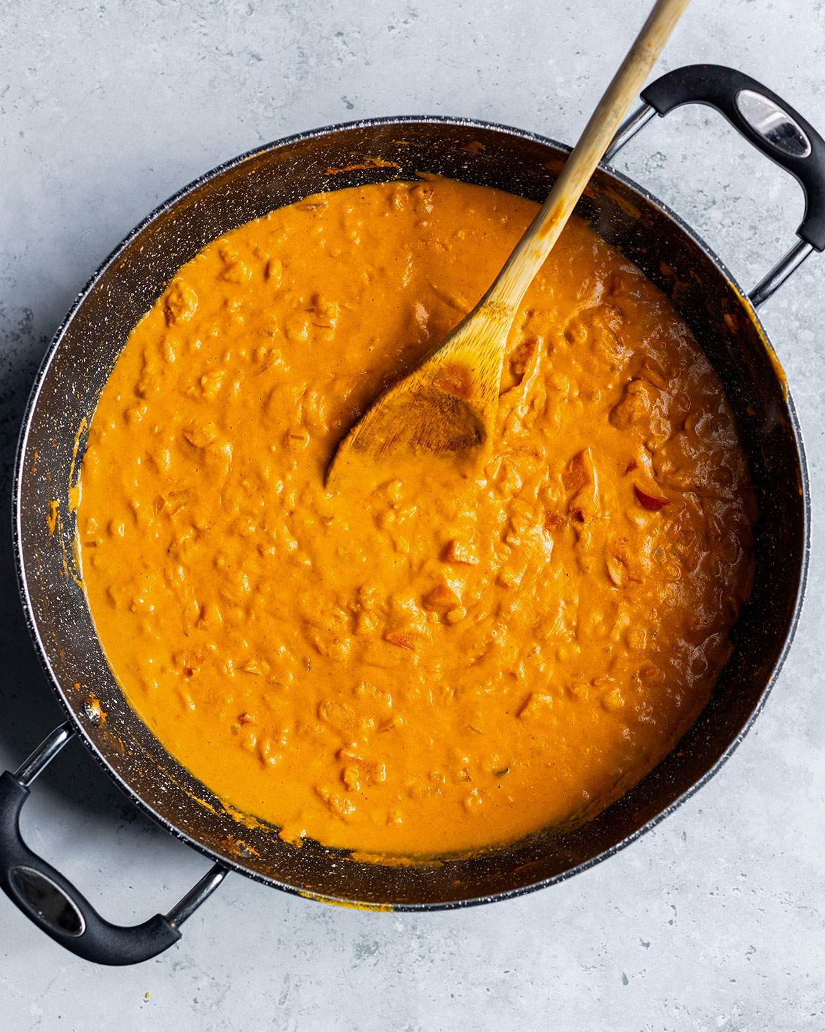 Creamy chickpea curry in a large skillet.