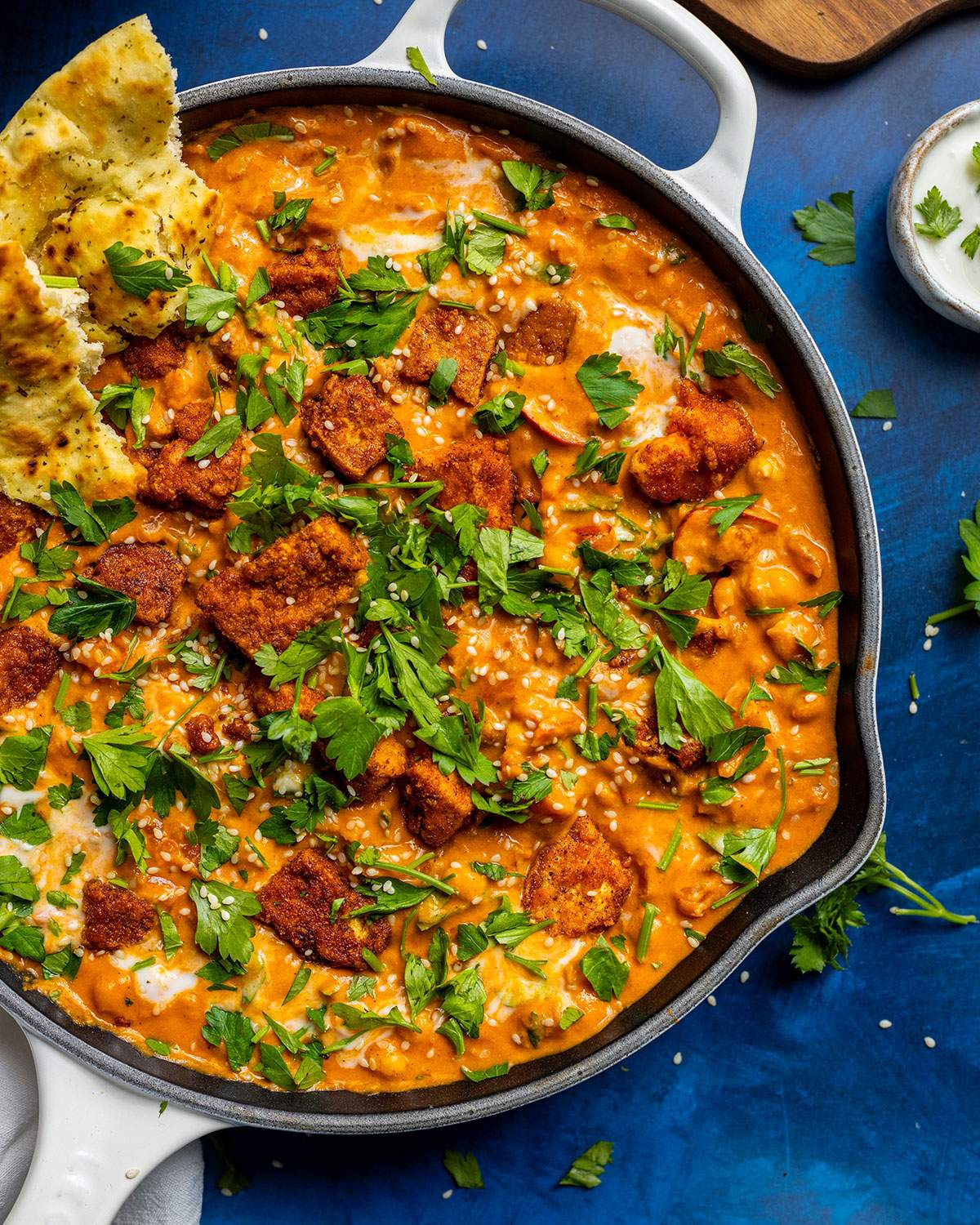 A skillet with butter chickpea curry.