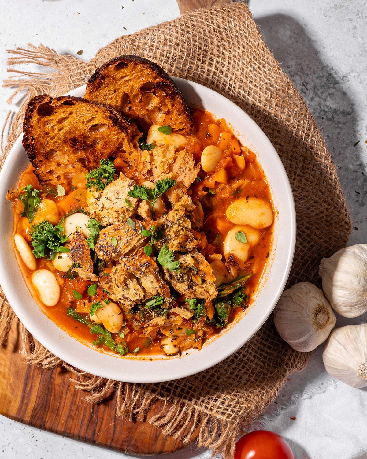 A bowl of hearty butter bean stew on the dinner table. 