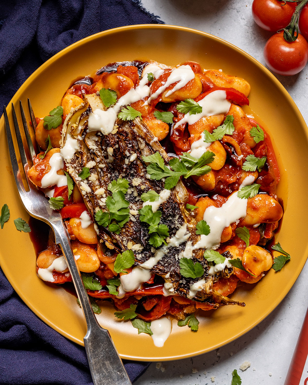 Seared cabbage on spicy beans in tomato sauce. 