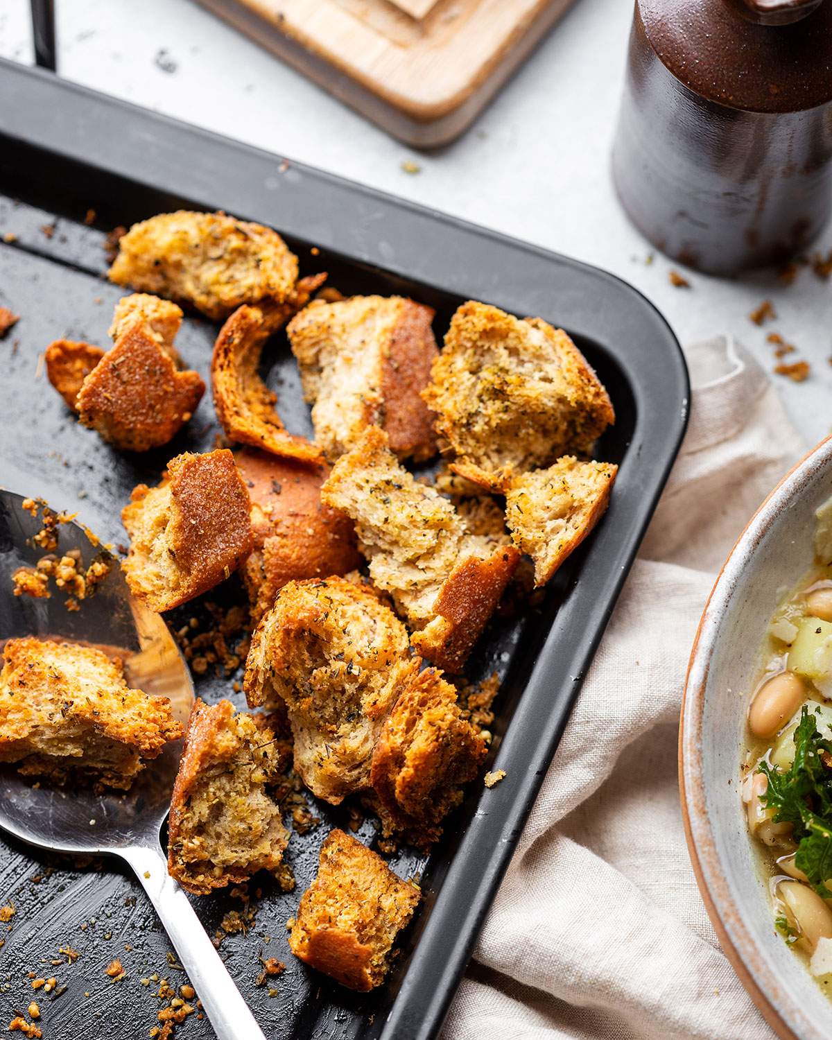 Rustic chunky croutons on a baking tray.