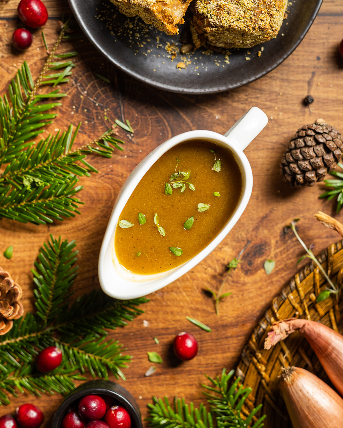A gravy boat filled with vegan caramelized onion gravy.