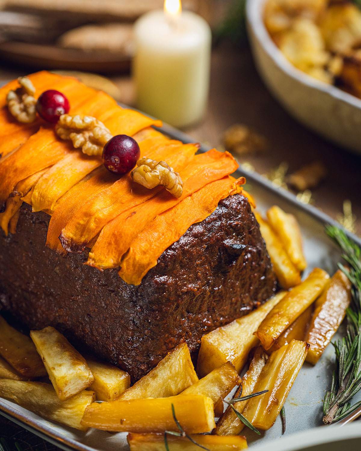 A vegan lentil nut roast on a serving tray.
