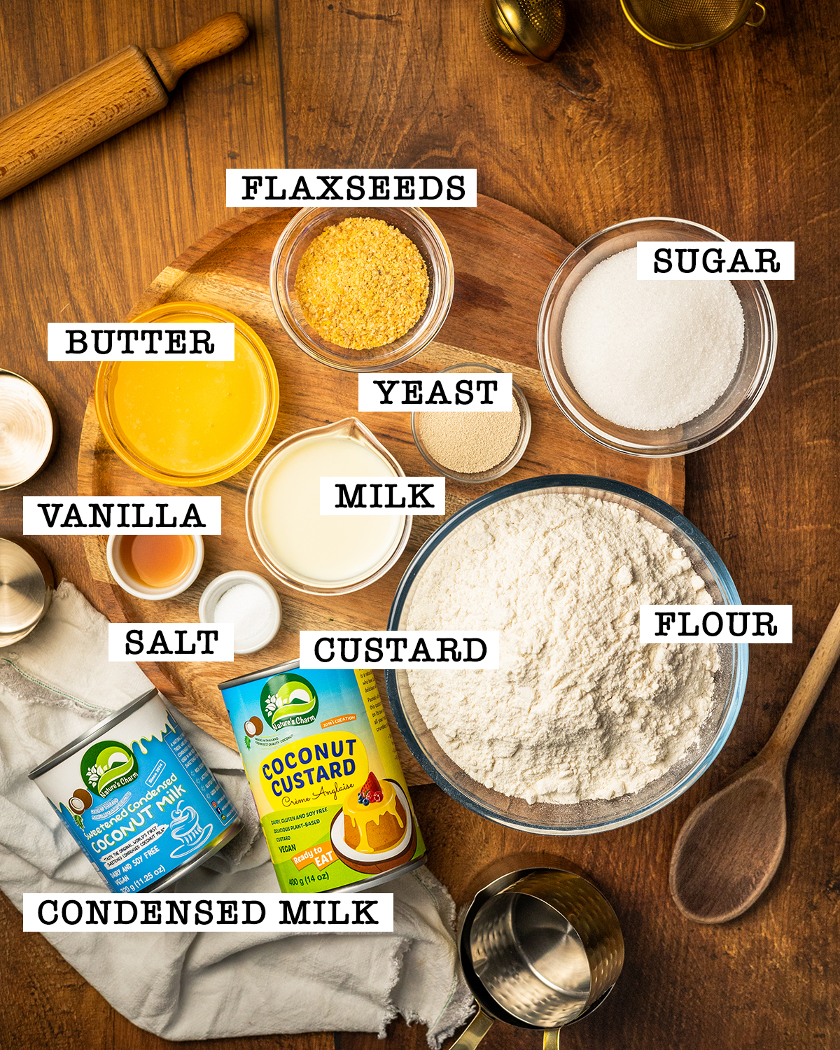 Ingredients for vegan custard donuts on a platter with labels.