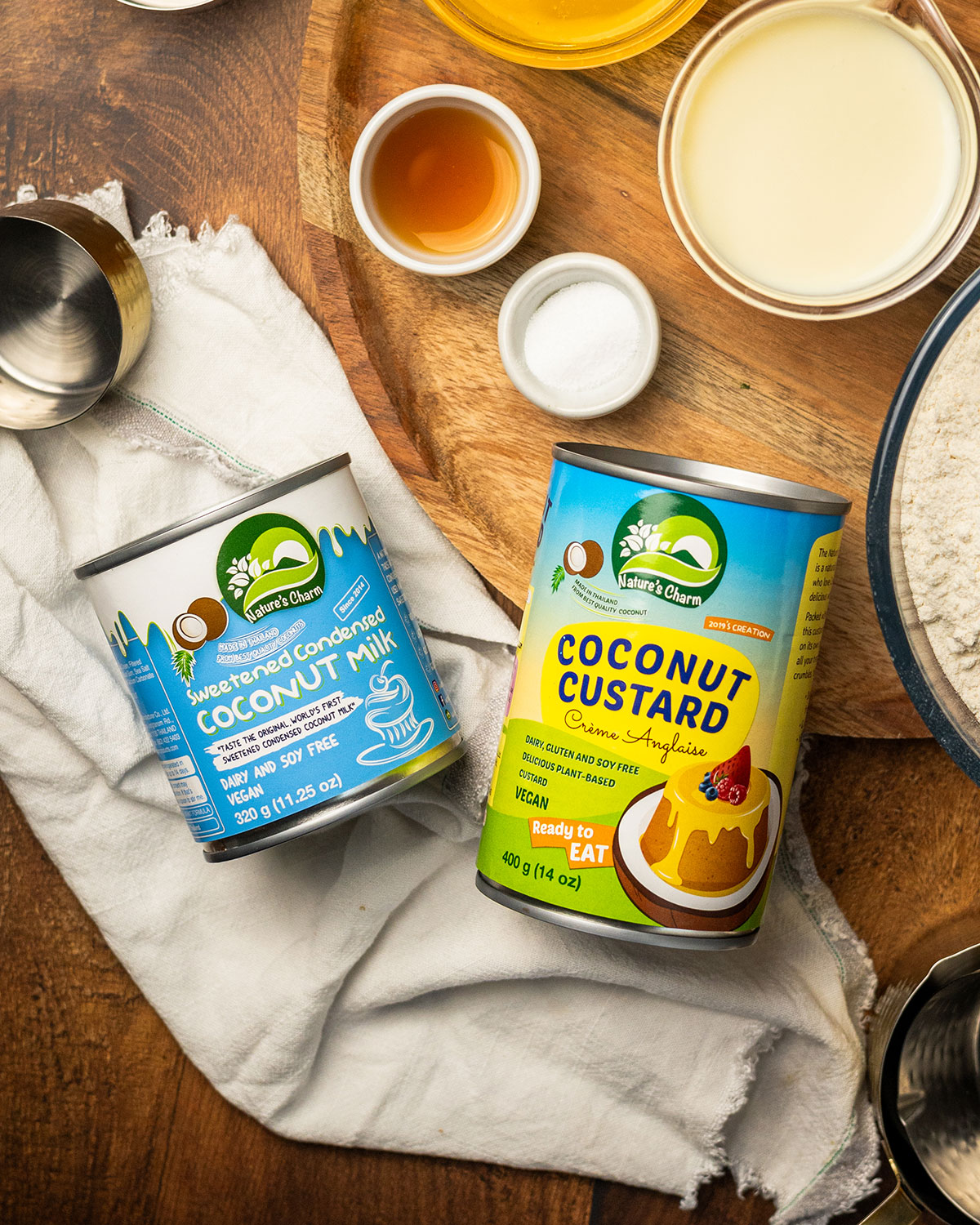 Tins of nature's charm condensed coconut milk and coconut custard.