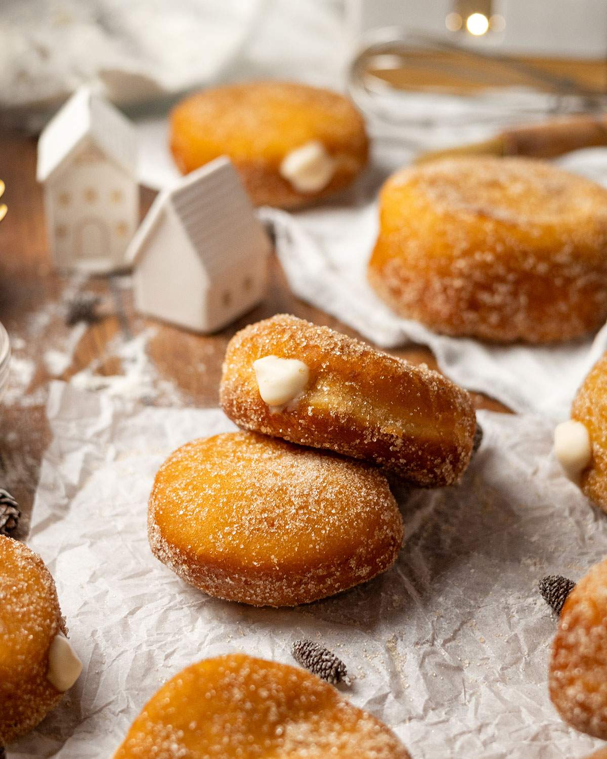 Fluffy vegan custard donuts on a parchment paper.