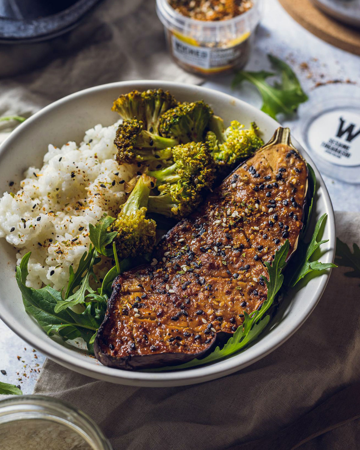 Roasted Miso Aubergine serve with a bowl of rice and vegetables.