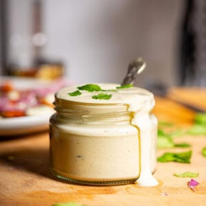 Creamy tofu sour cream in an open jar.