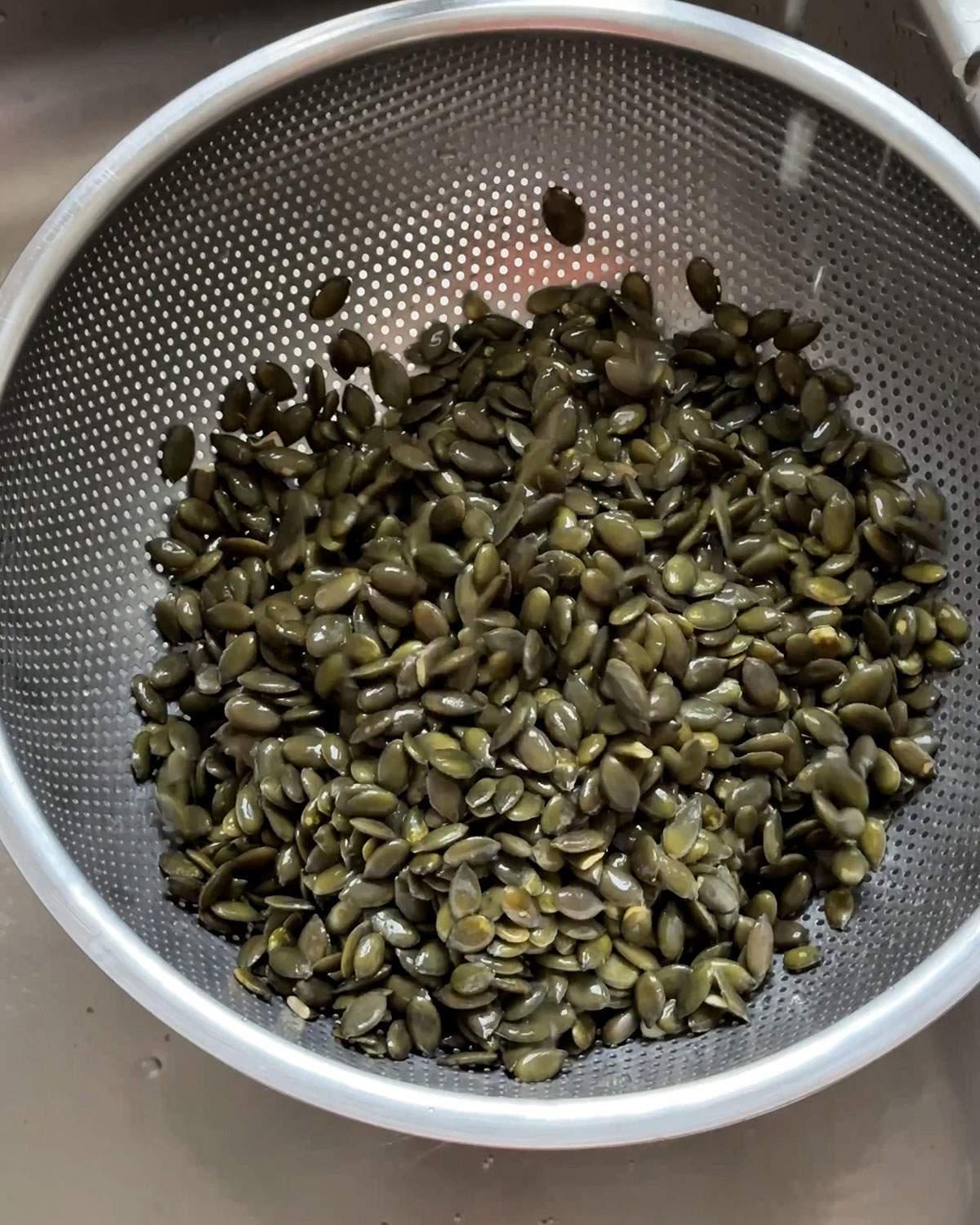 Drained soaked pumpkin seeds.
