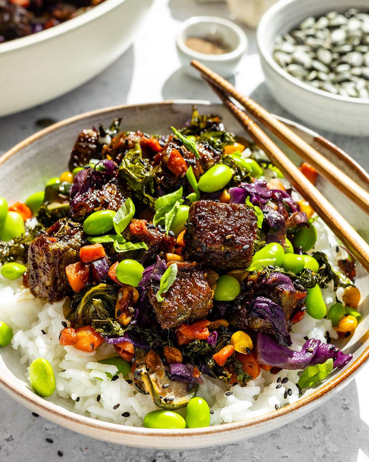 Pumfu tofu on a vibrant stir fry with rice.