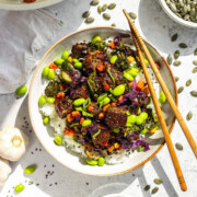 A plate of black pepper stir fry with crispy pumfu tofu and veggies.