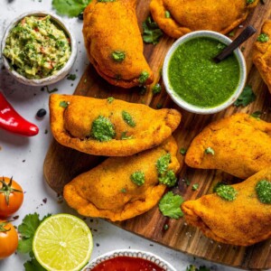 Air fryer empanadas on a serving board.