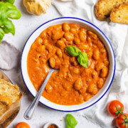 Creamy Butter Beans Alla Vodka on a plate with a spoon.