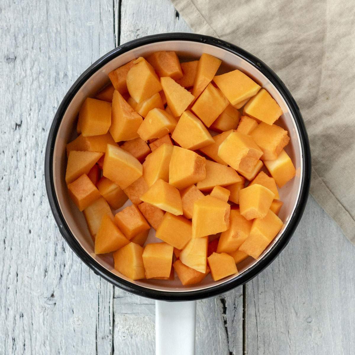 Cubes of pumpkin in a saucepan.