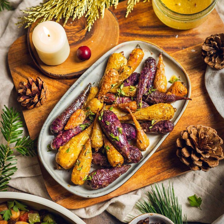 Roasted rainbow carrots on a serving tray.