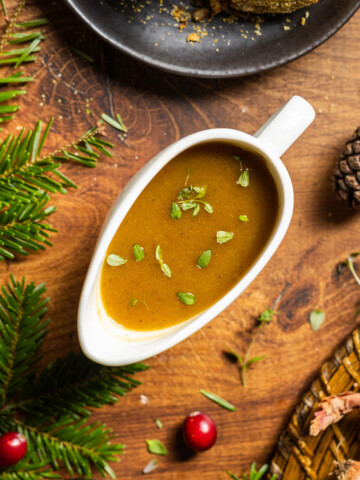 A gravy boat filled with vegan caramelized onion gravy.