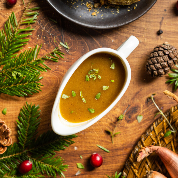 A gravy boat filled with vegan caramelized onion gravy.