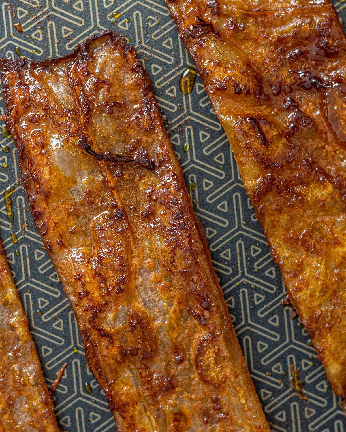Vegan rice paper Bacon strips in a pan.