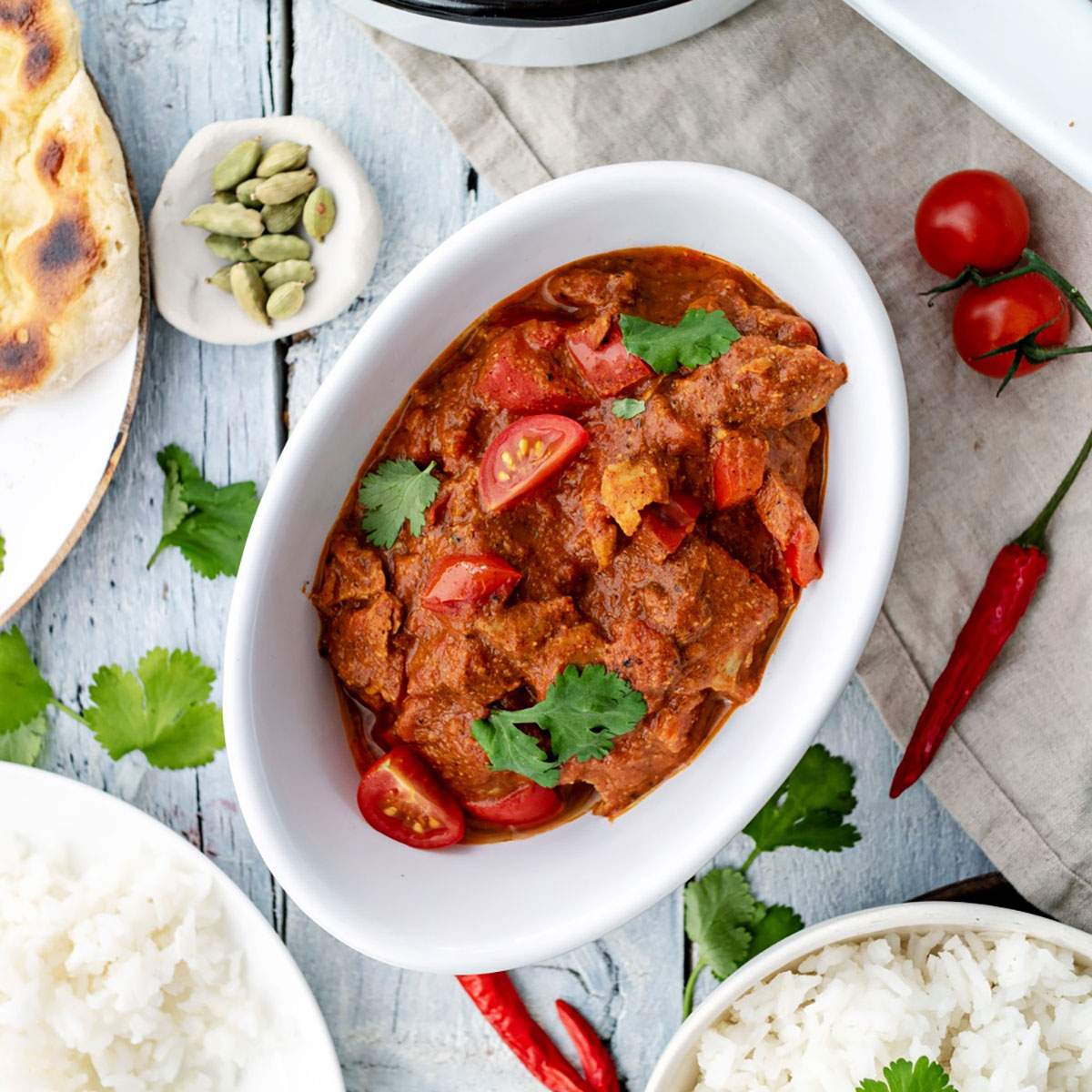 Vegan tikka masala in a small dish on the dinner table.