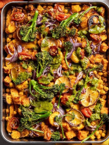 Roasted vegetables and chickpeas on a baking tray.