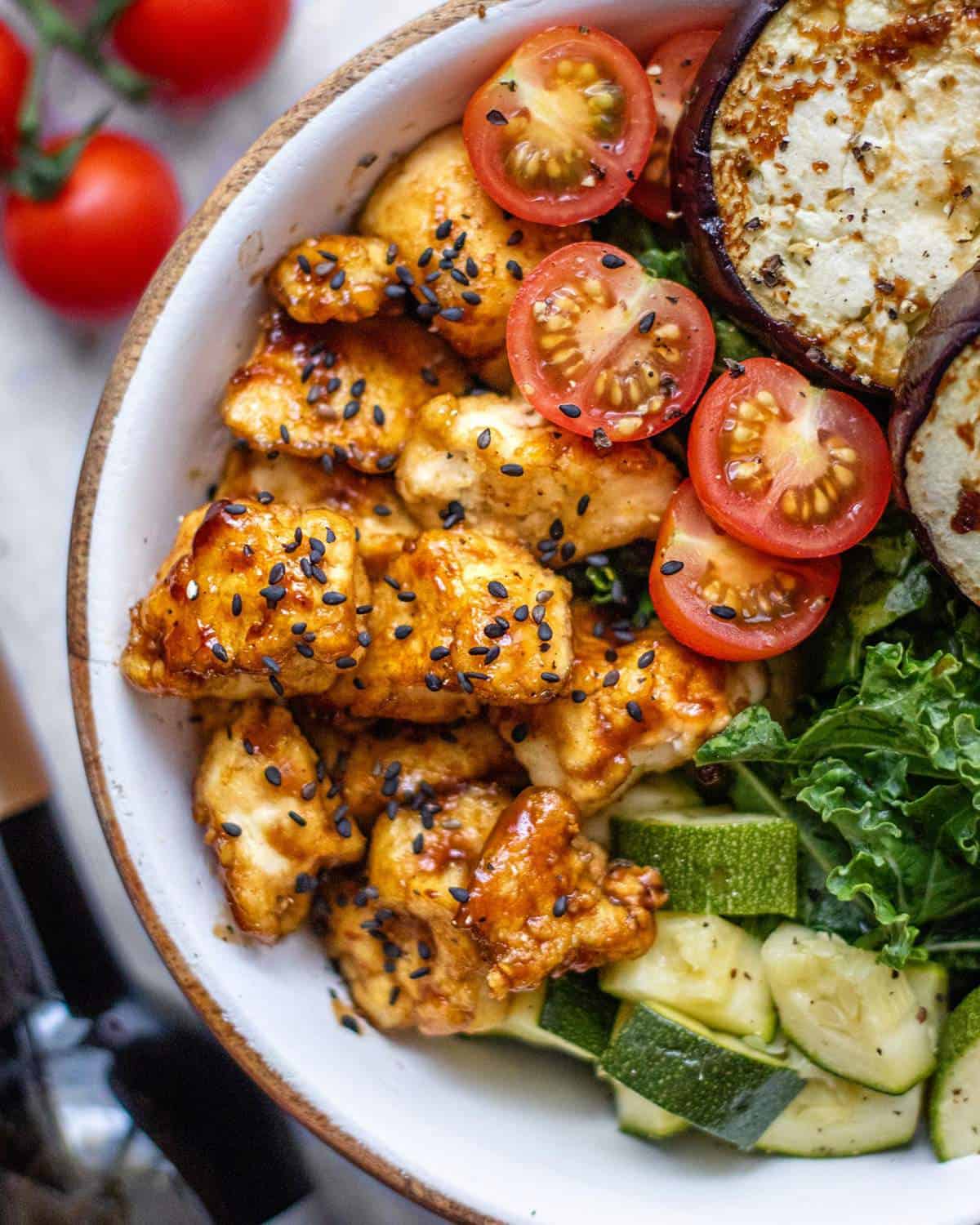 Sticky Balsamic tofu in a bowl with veggies.