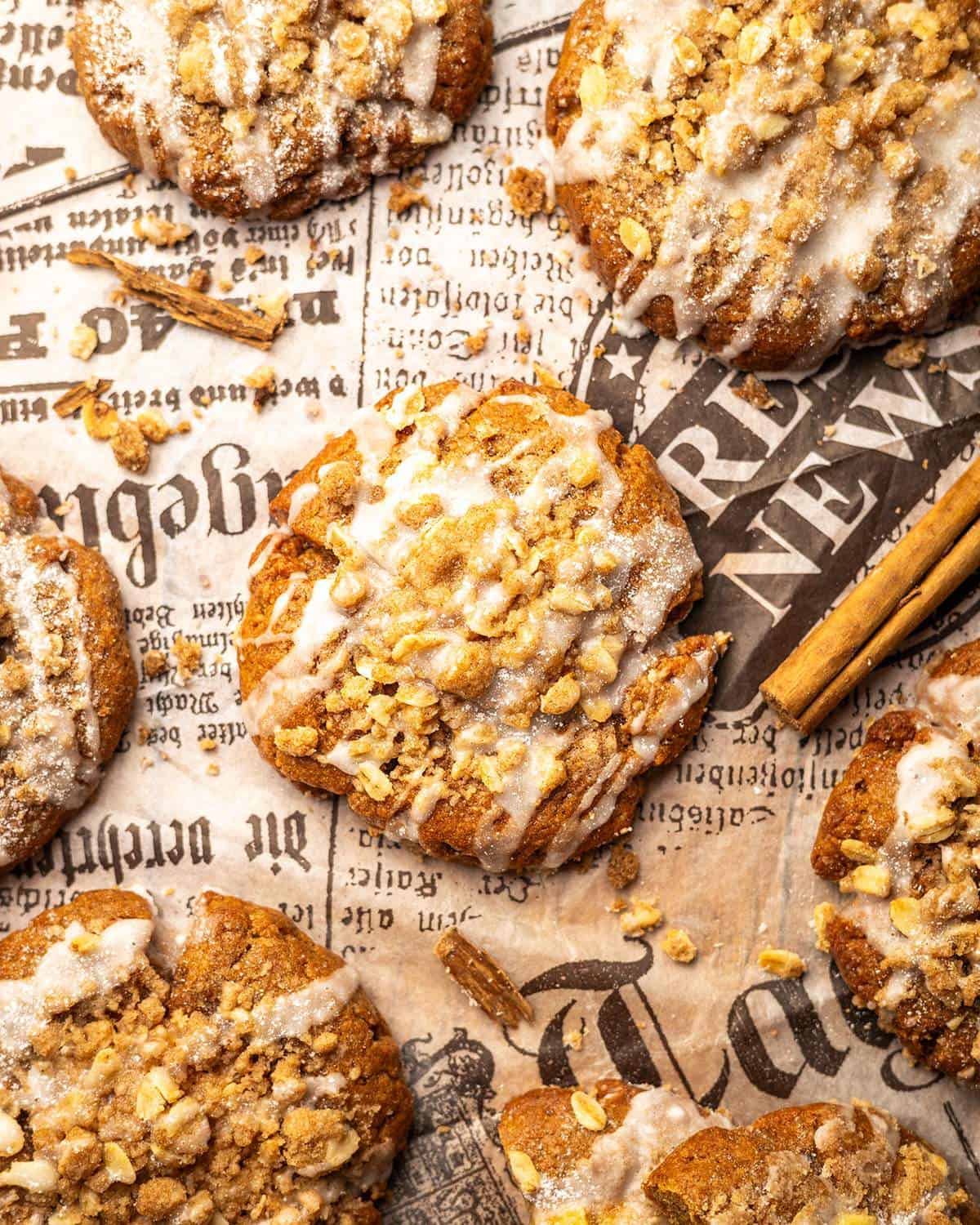 Vegan Apple crumble cookies with glaze on parchment paper.