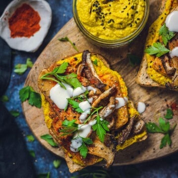 Curried Hummus and Tofu Sandwich on a serving board.