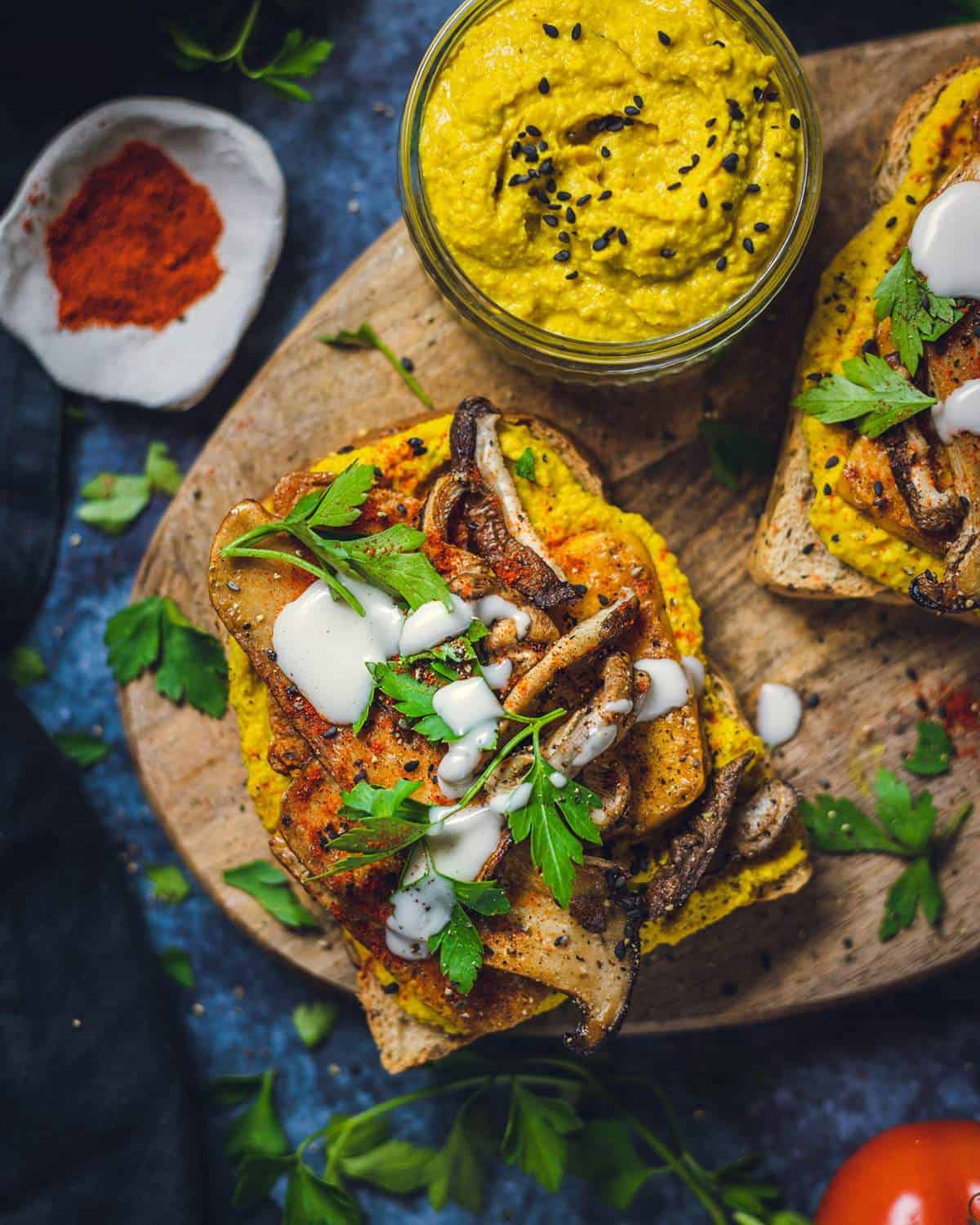 Curried Hummus and Tofu Sandwich on a serving board.