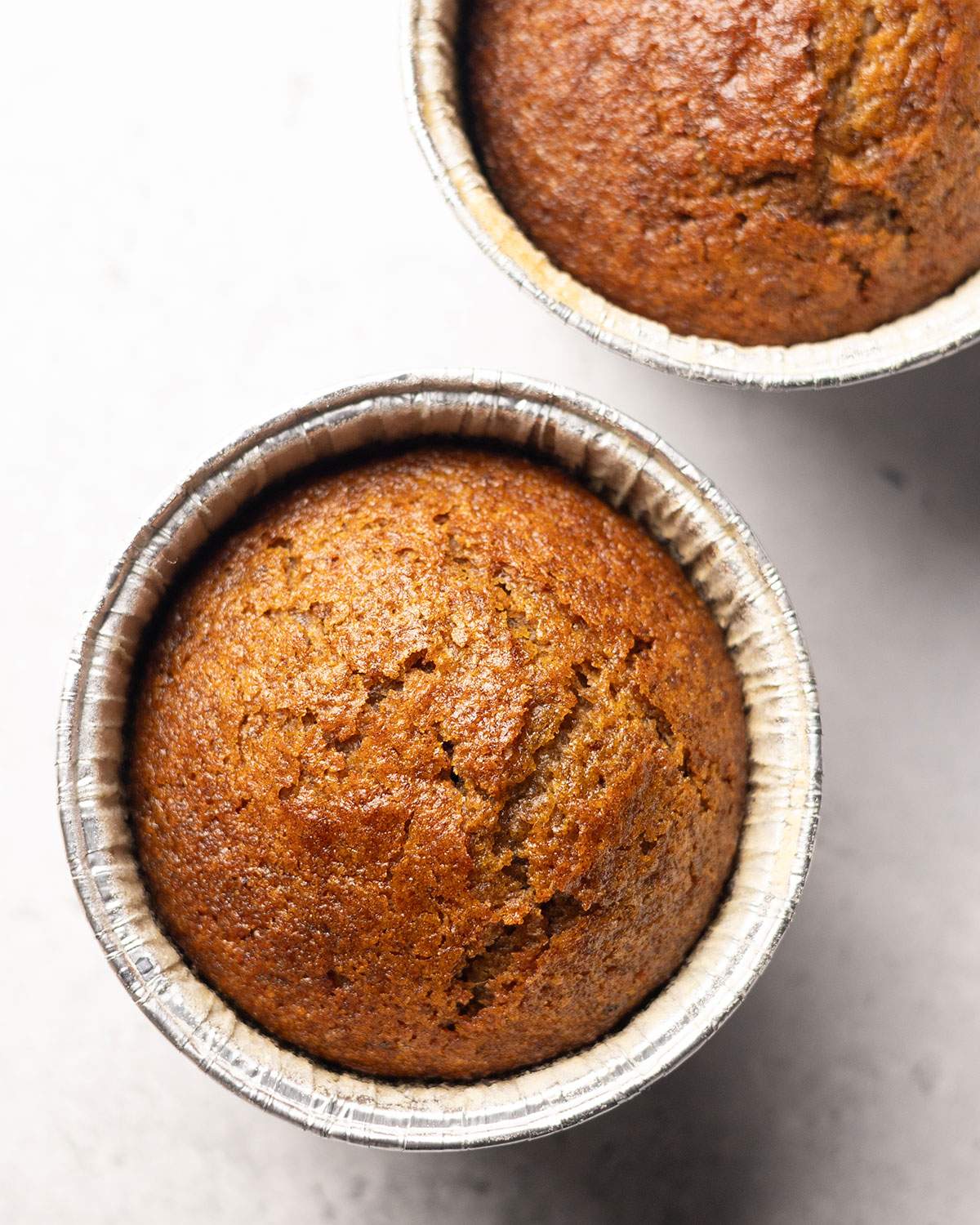 Baked sticky toffee pudding in a ramekin, fresh from the oven.