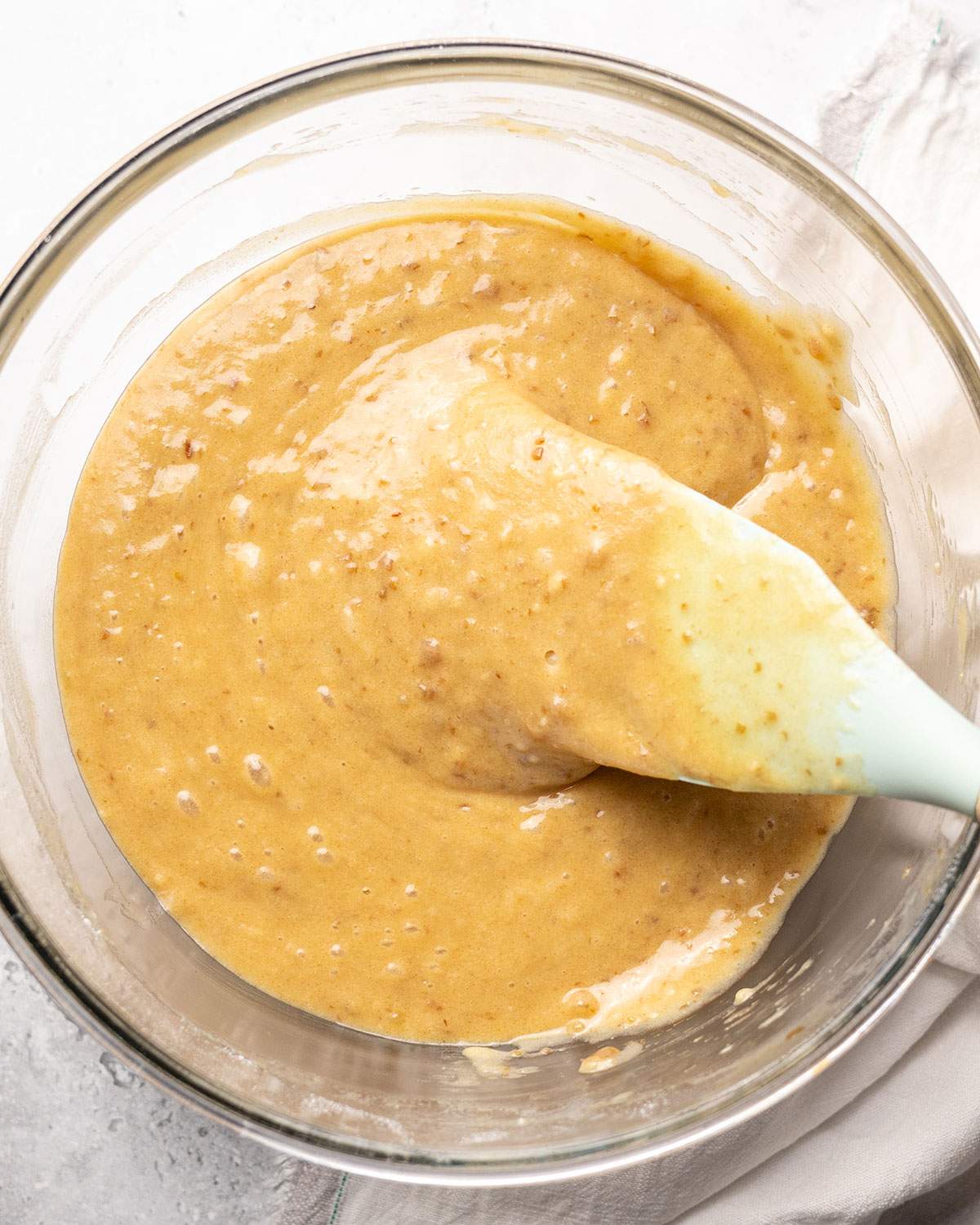 Smooth sticky toffee pudding batter in a mixing bowl.