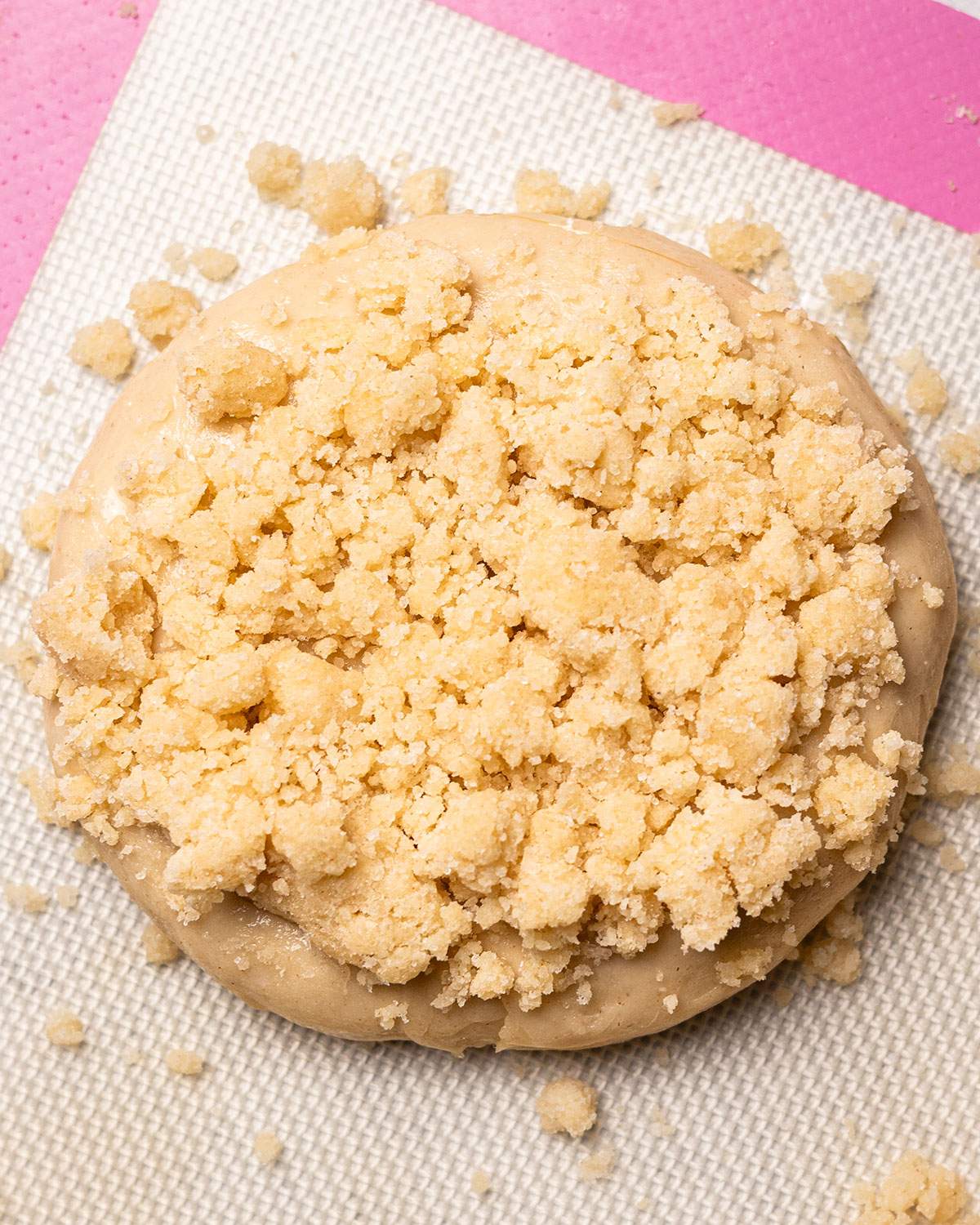 Crumble mixture tightly packed on a dough ball.